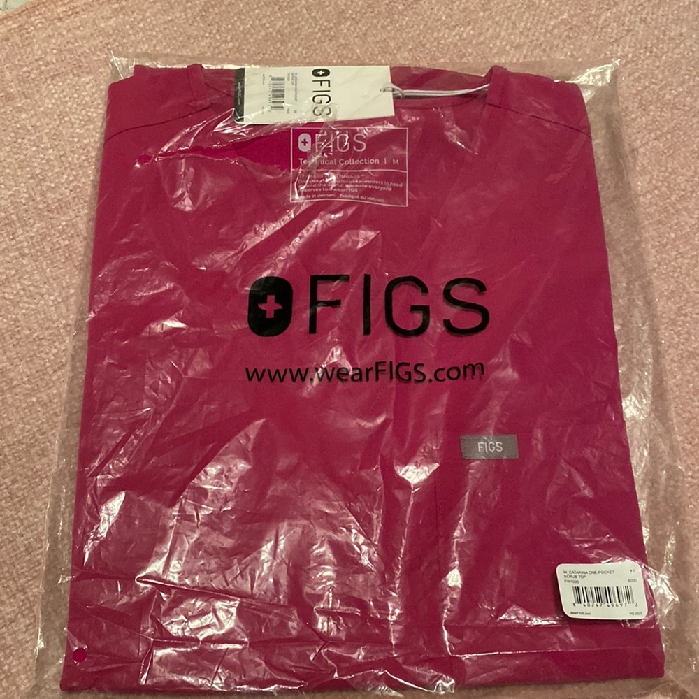 New Figs top.  HOT pink in color. Never removed from the bag.